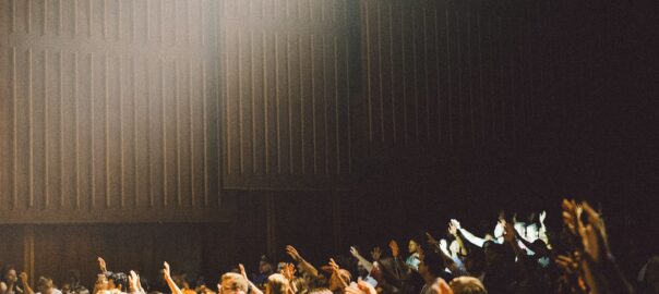 people raising their hands